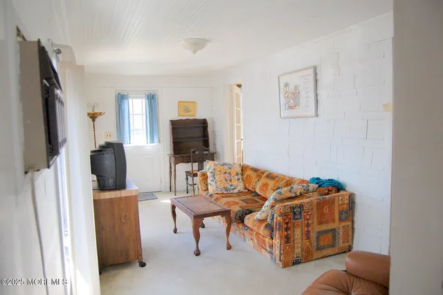 a bedroom with bed and window