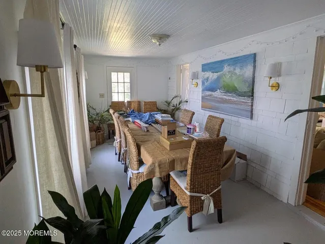 a view of a livingroom with furniture and a window