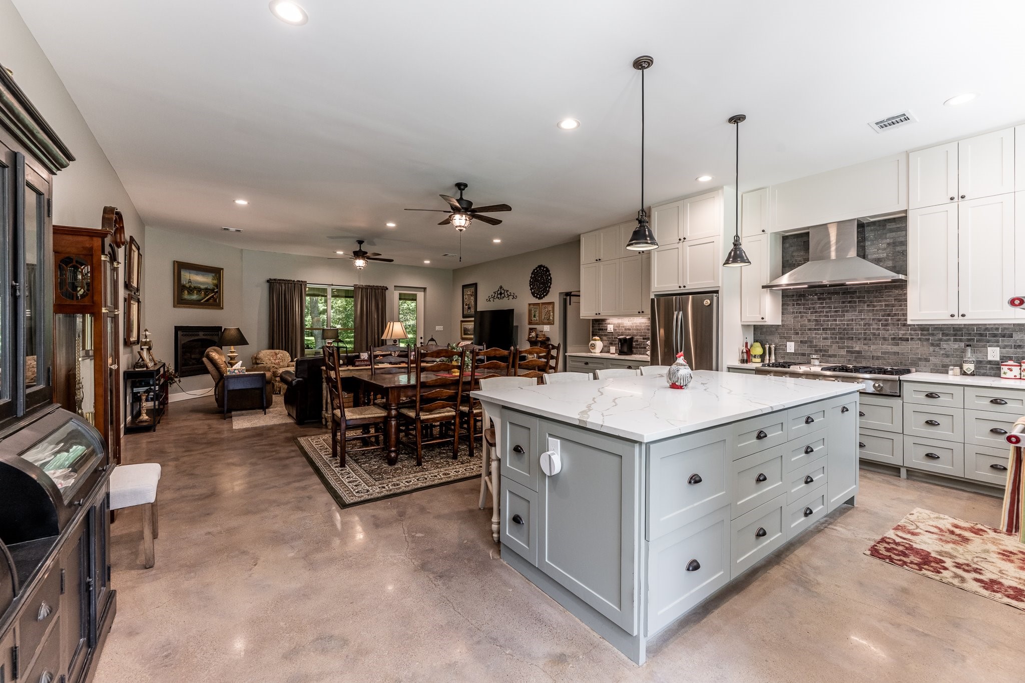 13334 Fultz Road Conroe, TX 77304 - Photo 2 of 49 Where upscale design meets down-home comfort—this open-concept kitchen is built for gathering, grazing, and making memories.