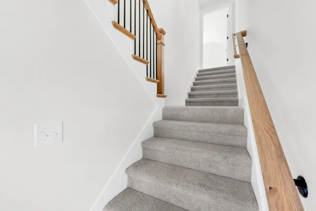 a view of staircase with white walls
