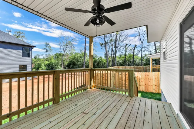 a view of balcony with wooden floor