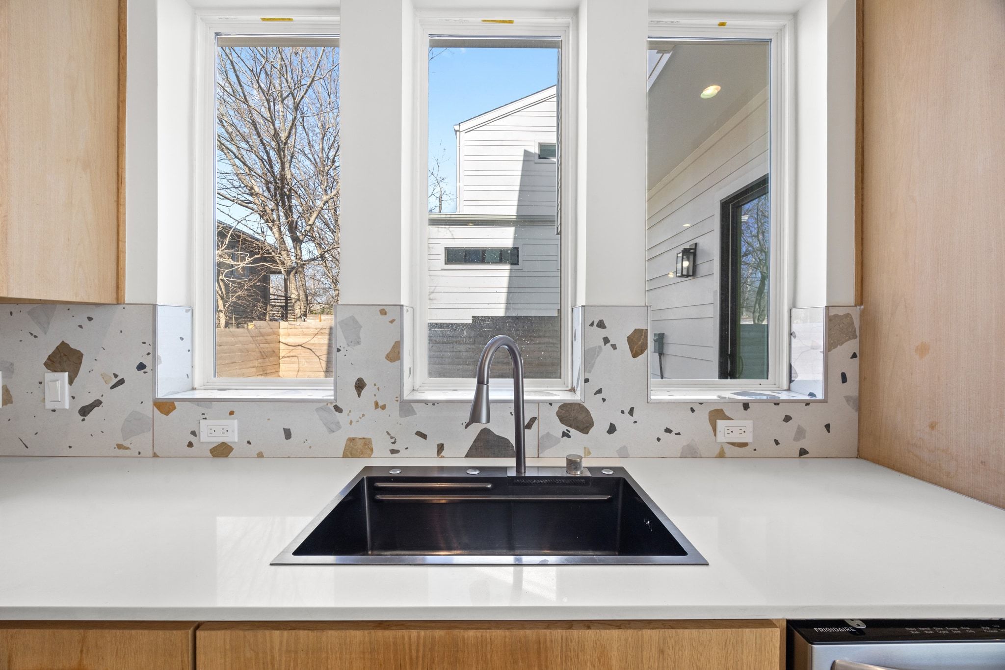 106 West Croslin Street, Unit 1 Austin, TX 78752 - Photo 12 of 31 a kitchen with a sink and a window