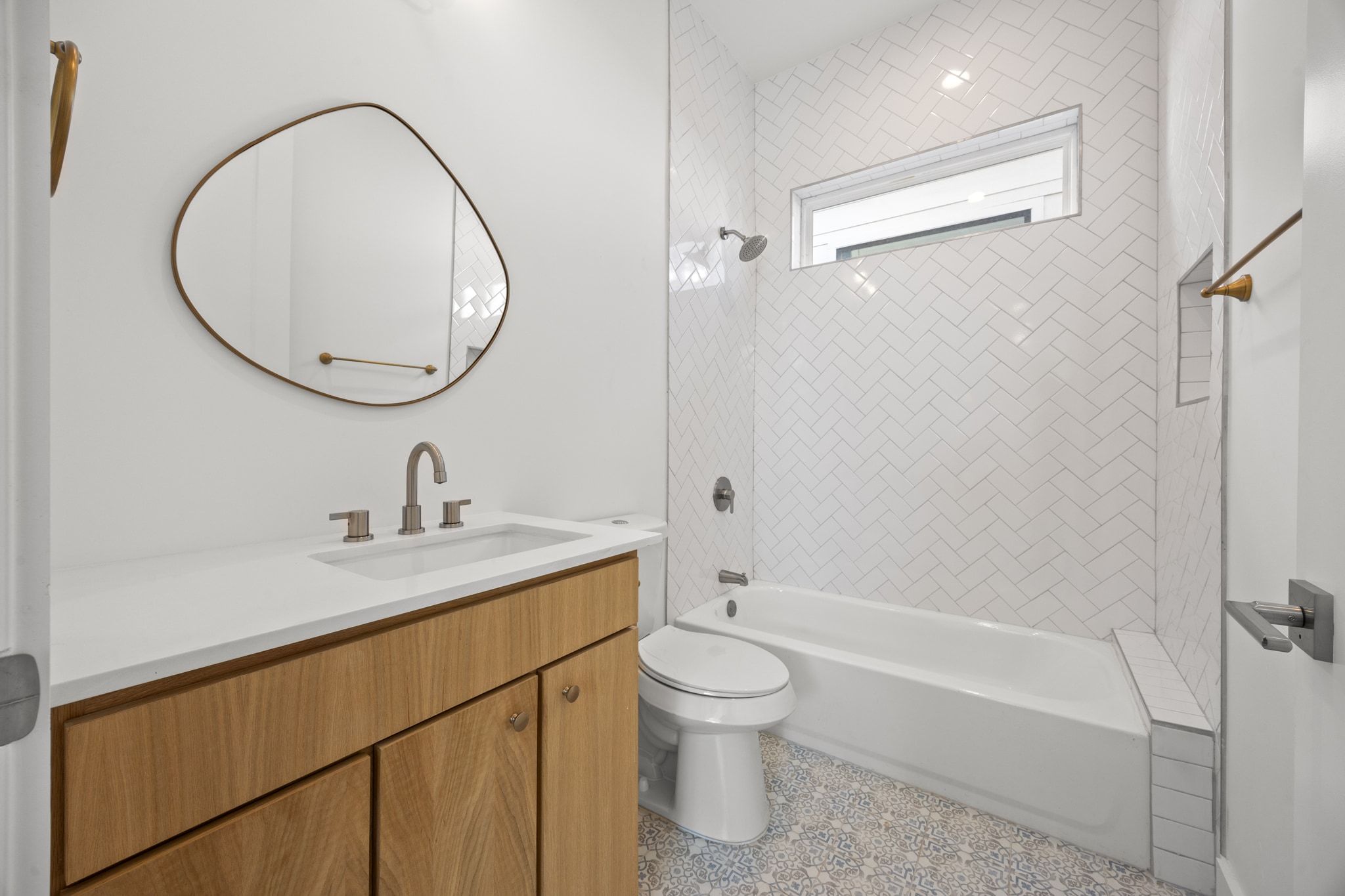 106 West Croslin Street, Unit 1 Austin, TX 78752 - Photo 14 of 31 a bathroom with a granite countertop sink a toilet and a mirror