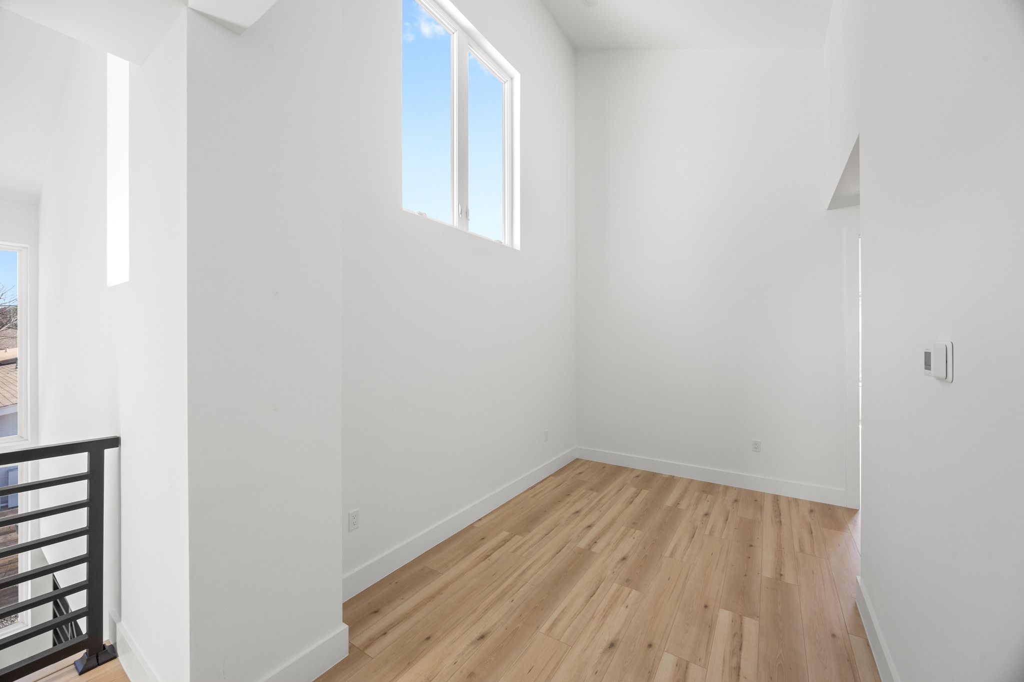 106 West Croslin Street, Unit 1 Austin, TX 78752 - Photo 21 of 31 a view of a room with wooden floor and small window