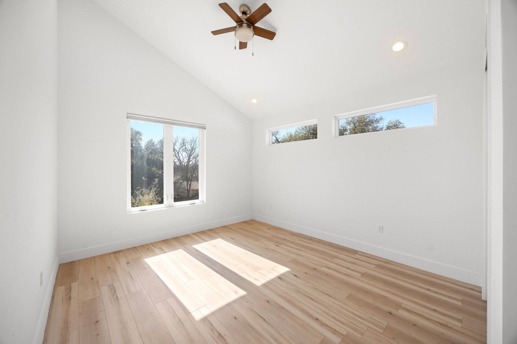 106 West Croslin Street, Unit 1 Austin, TX 78752 - Photo 25 of 31 wooden floor in an empty room with a window