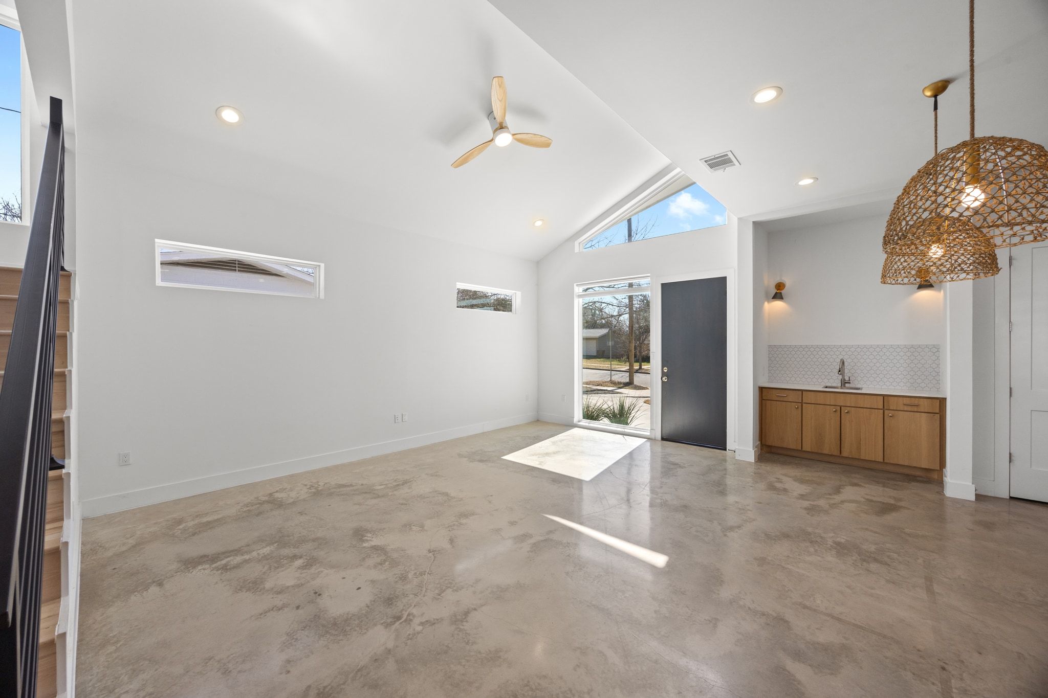 106 West Croslin Street, Unit 1 Austin, TX 78752 - Photo 4 of 31 a view of a kitchen with a sink and a large window