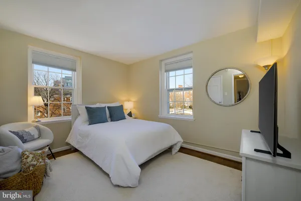 a bedroom with bed and window
