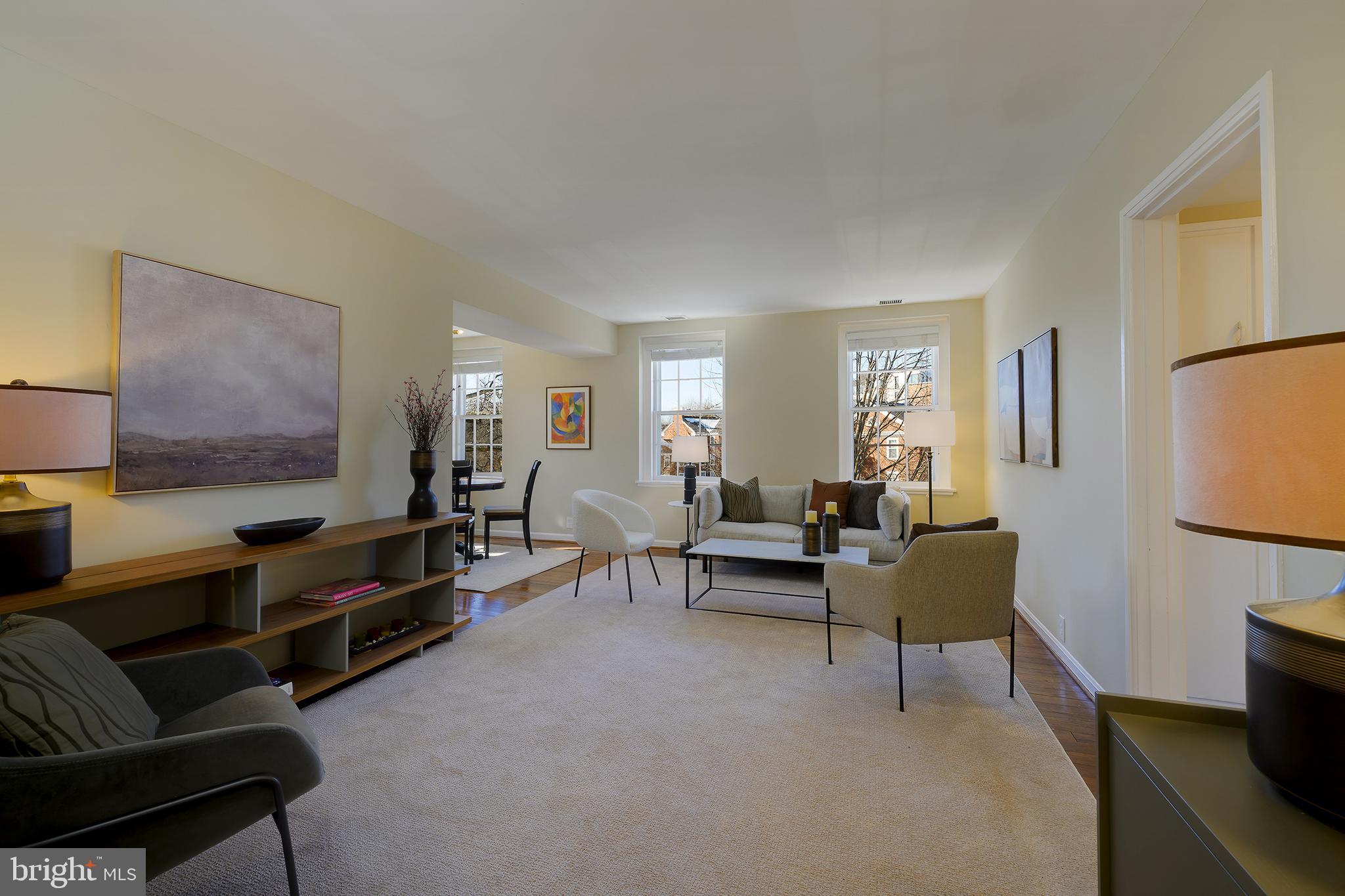 3690 38th Street Northwest, Unit C237 Washington, DC 20016 - Photo 3 of 35 a living room with furniture and a flat screen tv