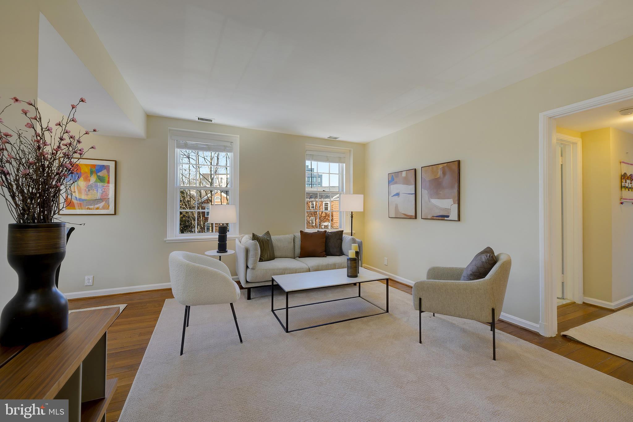 3690 38th Street Northwest, Unit C237 Washington, DC 20016 - Photo 5 of 35 a living room with furniture and a potted plant