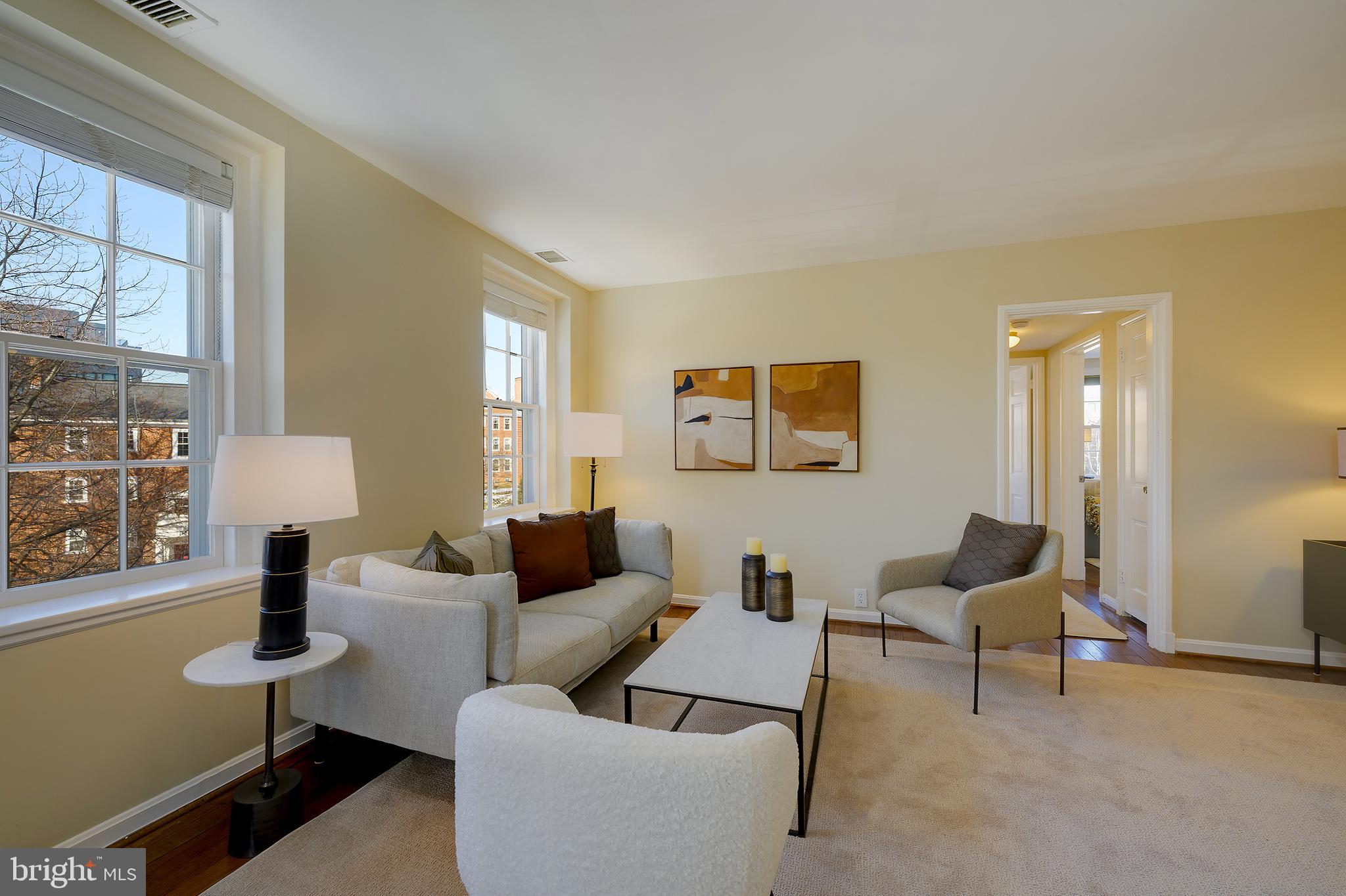 3690 38th Street Northwest, Unit C237 Washington, DC 20016 - Photo 6 of 35 a living room with furniture and a large window