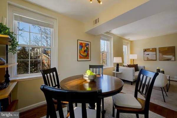 a kitchen with stainless steel appliances granite countertop a stove microwave and sink