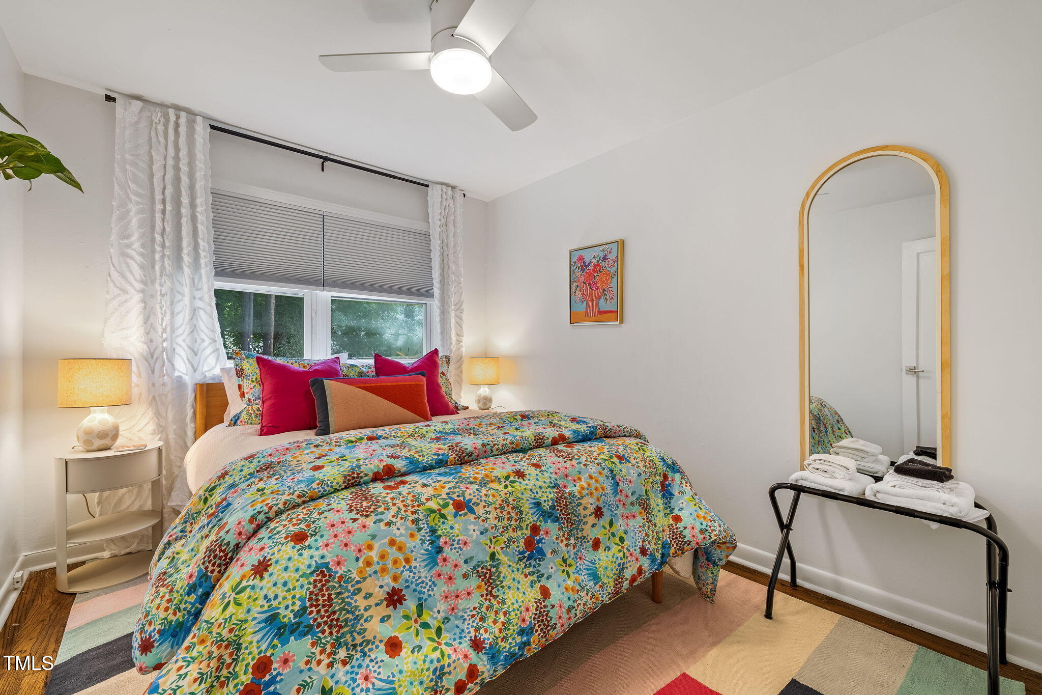 1911 Morehead Avenue Durham, NC 27707 - Photo 12 of 25 a bedroom with a bed and a chandelier