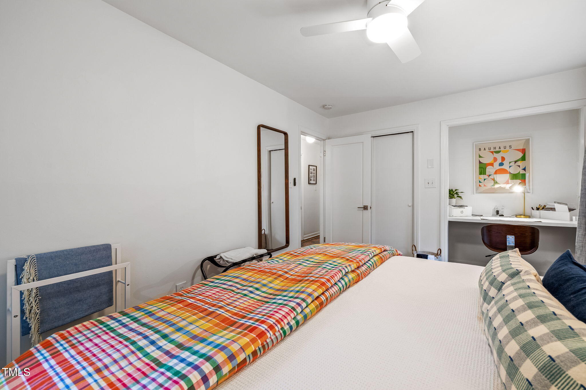 1911 Morehead Avenue Durham, NC 27707 - Photo 14 of 25 a bedroom with bed and paintings on the wall