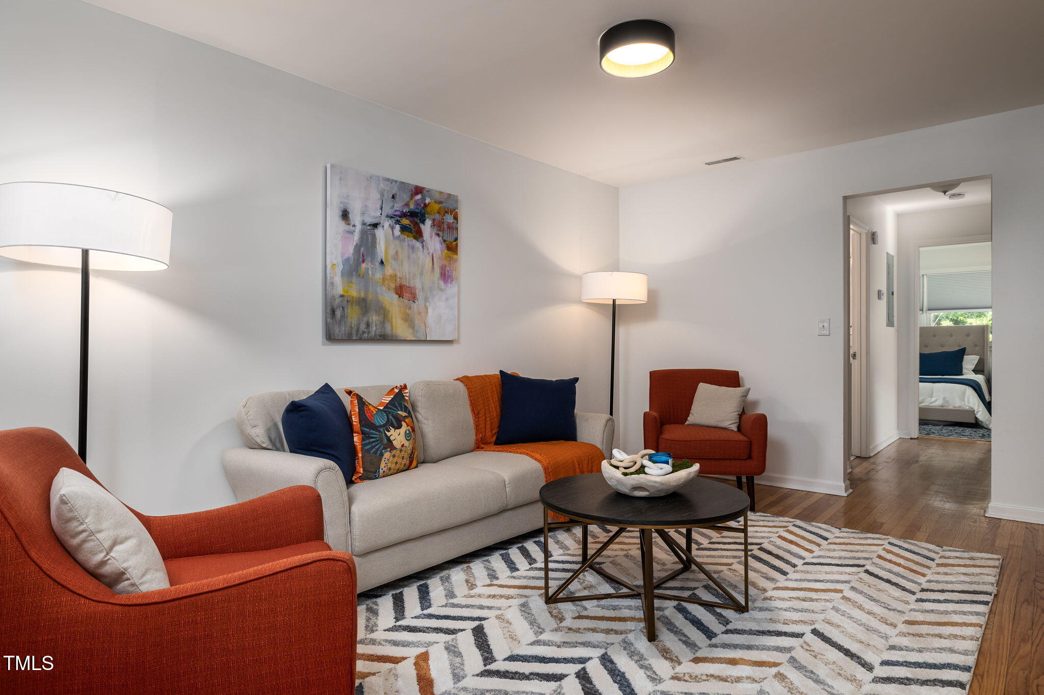 1911 Morehead Avenue Durham, NC 27707 - Photo 16 of 25 a living room with furniture a rug and a lamp