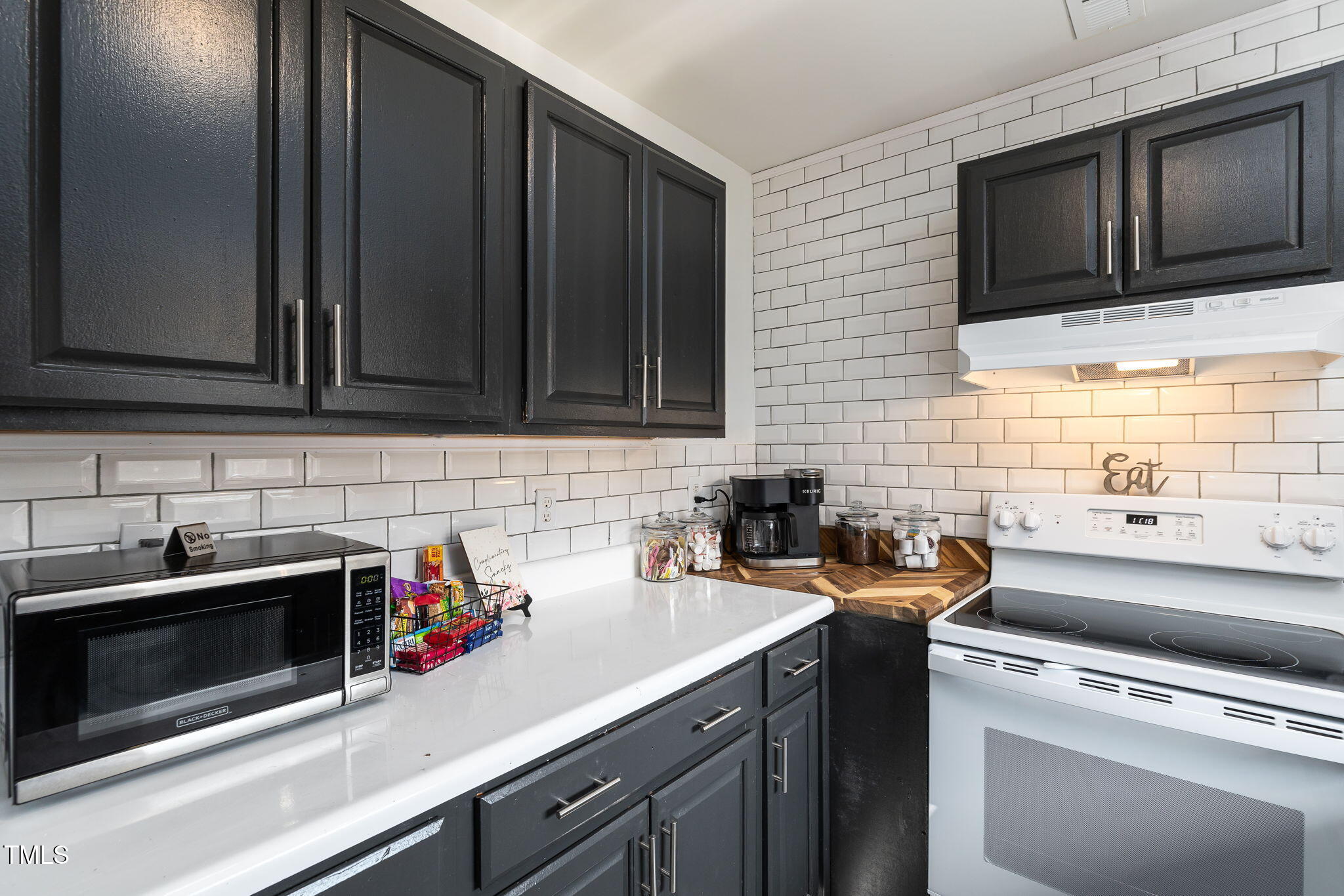 1911 Morehead Avenue Durham, NC 27707 - Photo 19 of 25 a kitchen with a sink and cabinets
