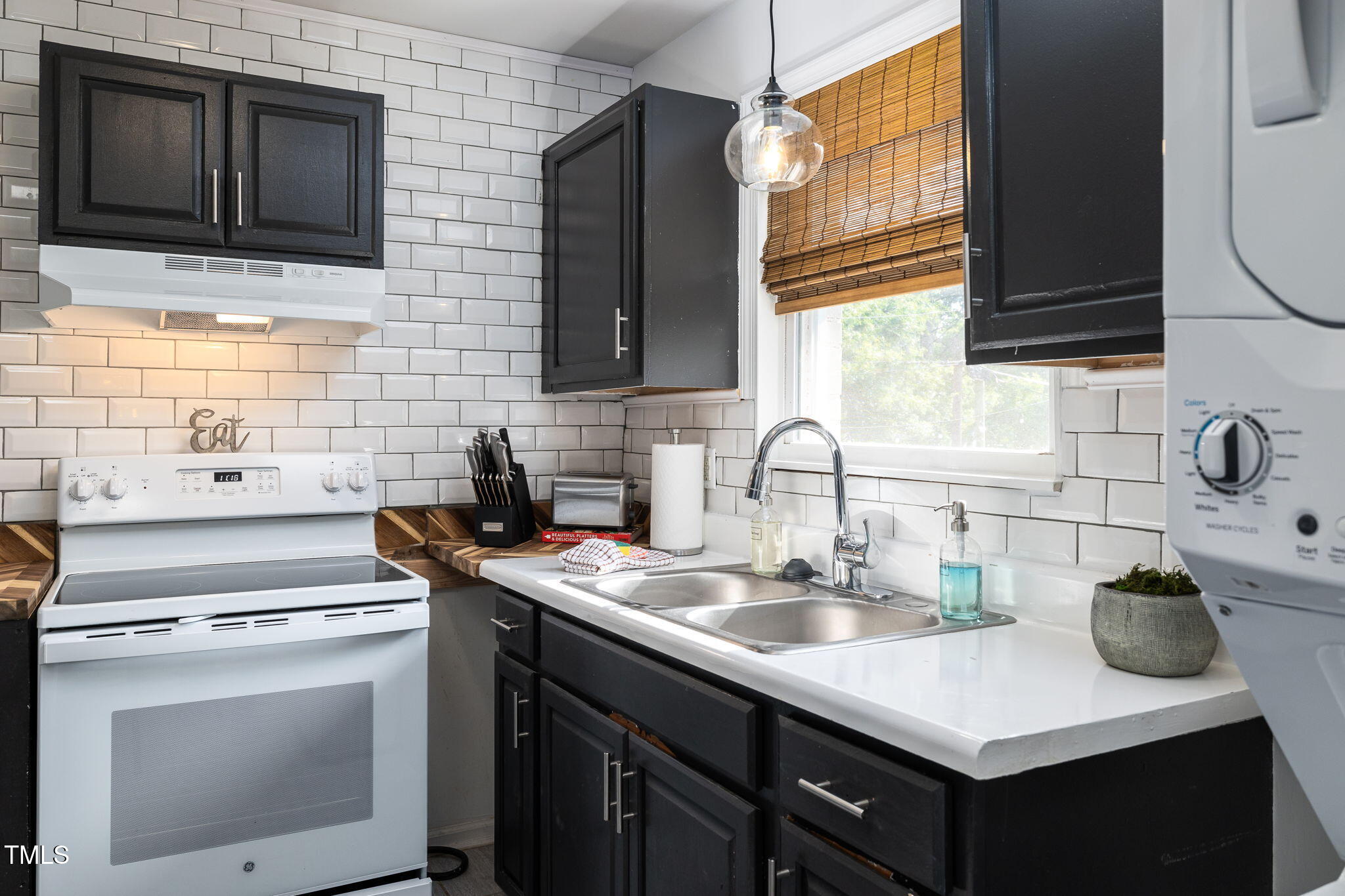 1911 Morehead Avenue Durham, NC 27707 - Photo 20 of 25 a kitchen with a sink stove and microwave