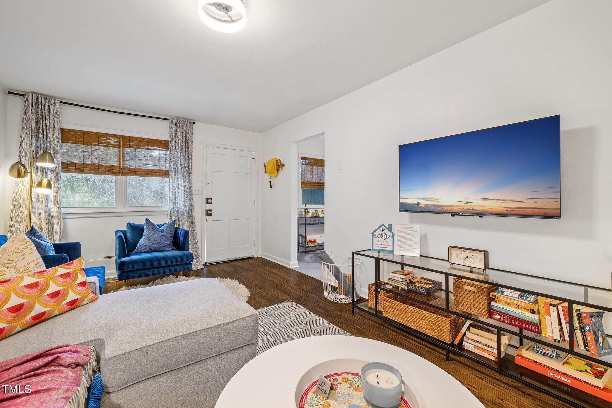 1911 Morehead Avenue Durham, NC 27707 - Photo 4 of 25 a bedroom with furniture and a flat screen tv