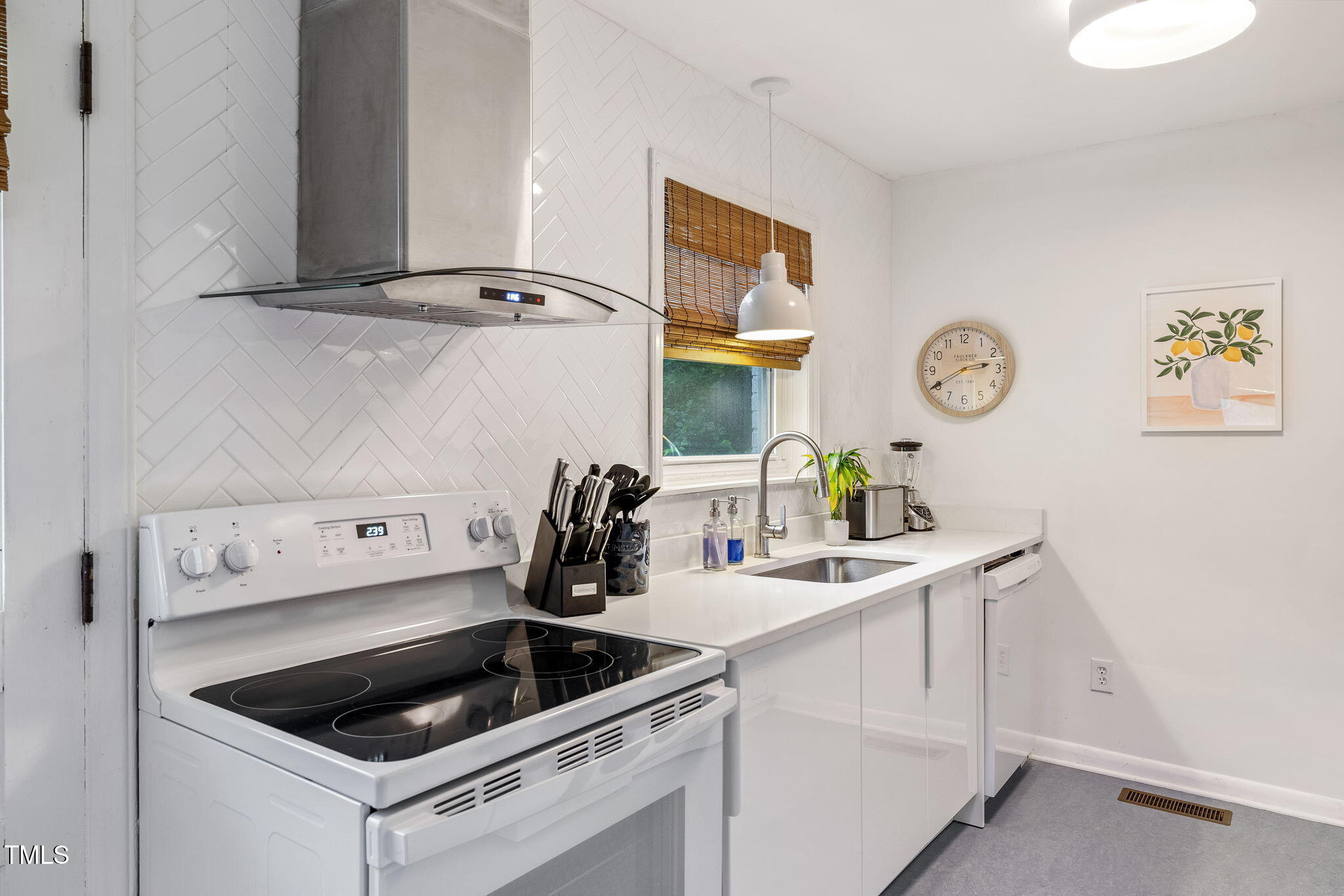 1911 Morehead Avenue Durham, NC 27707 - Photo 7 of 25 a kitchen with a sink and cabinets