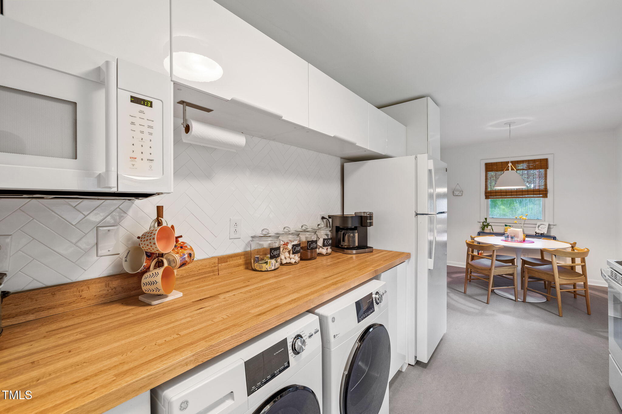 1911 Morehead Avenue Durham, NC 27707 - Photo 8 of 25 a utility room with sink dryer and washer