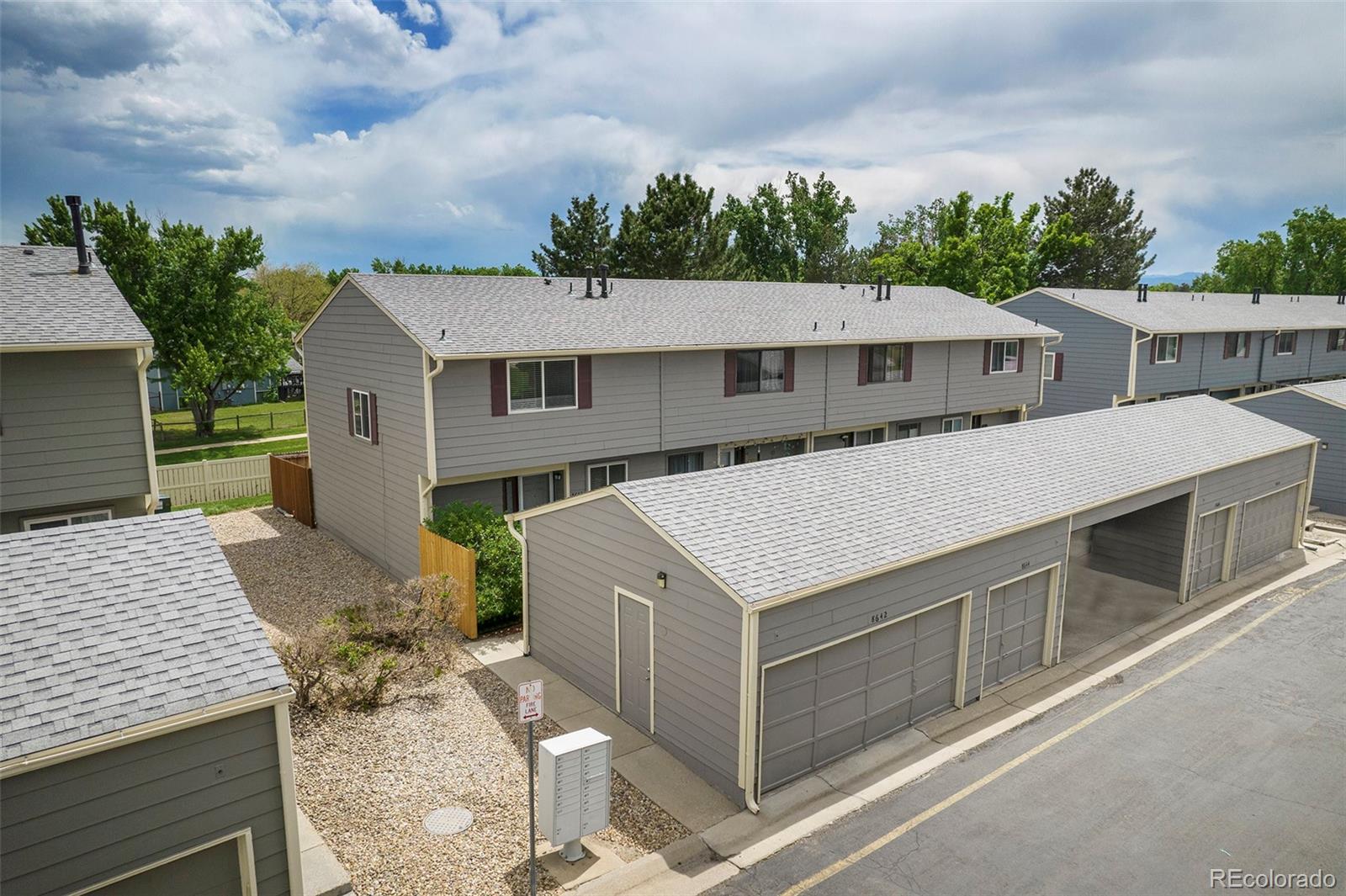 8642 Carr Loop Arvada, CO 80005 - Photo 3 of 22 a aerial view of a house with a yard and balcony