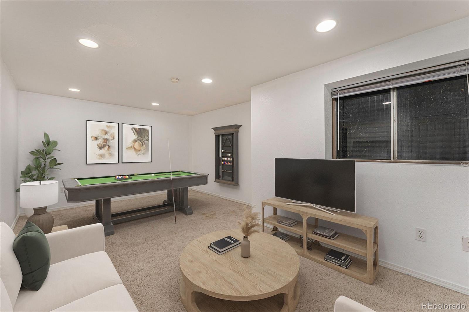 8642 Carr Loop Arvada, CO 80005 - Photo 7 of 22 a living room with furniture and a flat screen tv