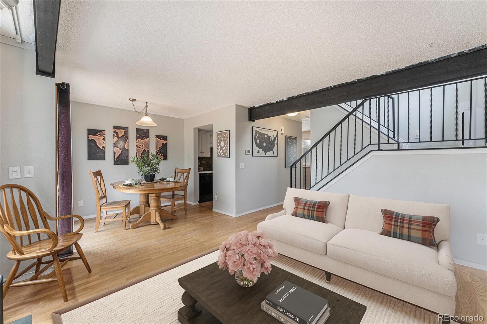 8642 Carr Loop Arvada, CO 80005 - Photo 9 of 22 a living room with furniture and wooden floor