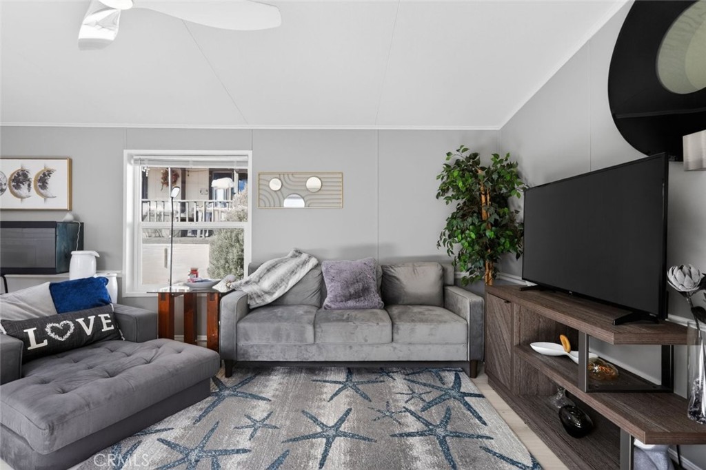 2801 Johnson Road, Unit 14 Frazier Park, CA 93225 - Photo 11 of 30 a living room with furniture a flat screen tv and a potted plant