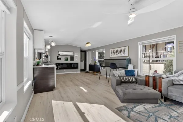 a living room with furniture and a piano