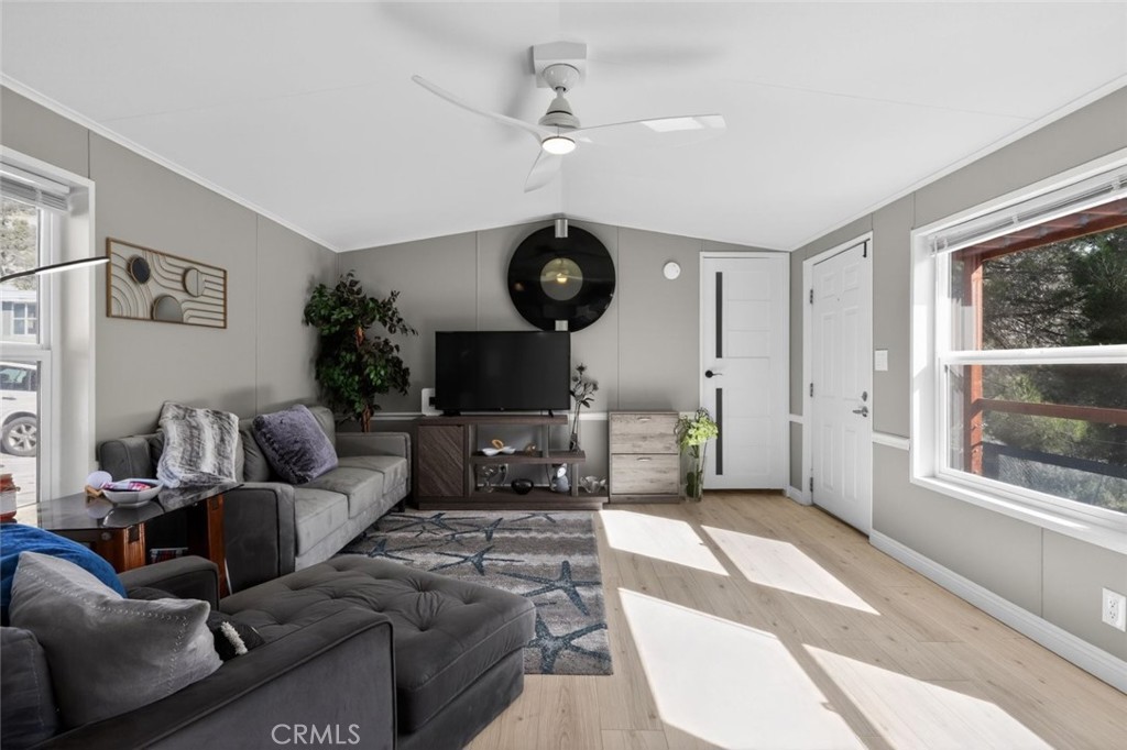 2801 Johnson Road, Unit 14 Frazier Park, CA 93225 - Photo 9 of 30 a living room with furniture a flat screen tv and a large window