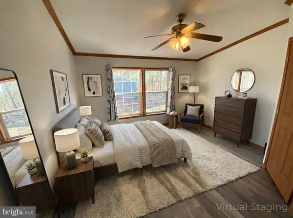 a spacious bedroom with a bed and window