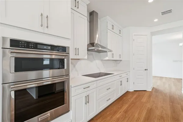 a kitchen with stainless steel appliances granite countertop a stove and a sink
