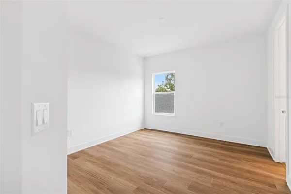 a room with lots of windows and white walls