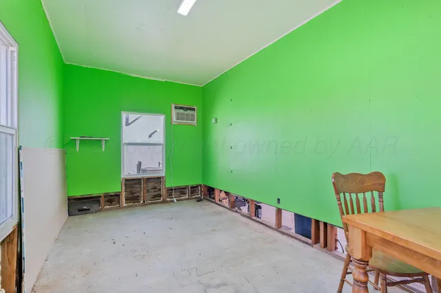 a room with furniture and a window