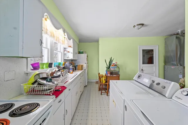 a bedroom with a bed and cabinets