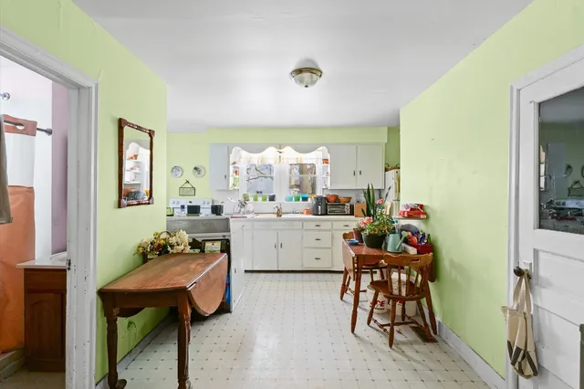 a room with furniture a dining table and a sink