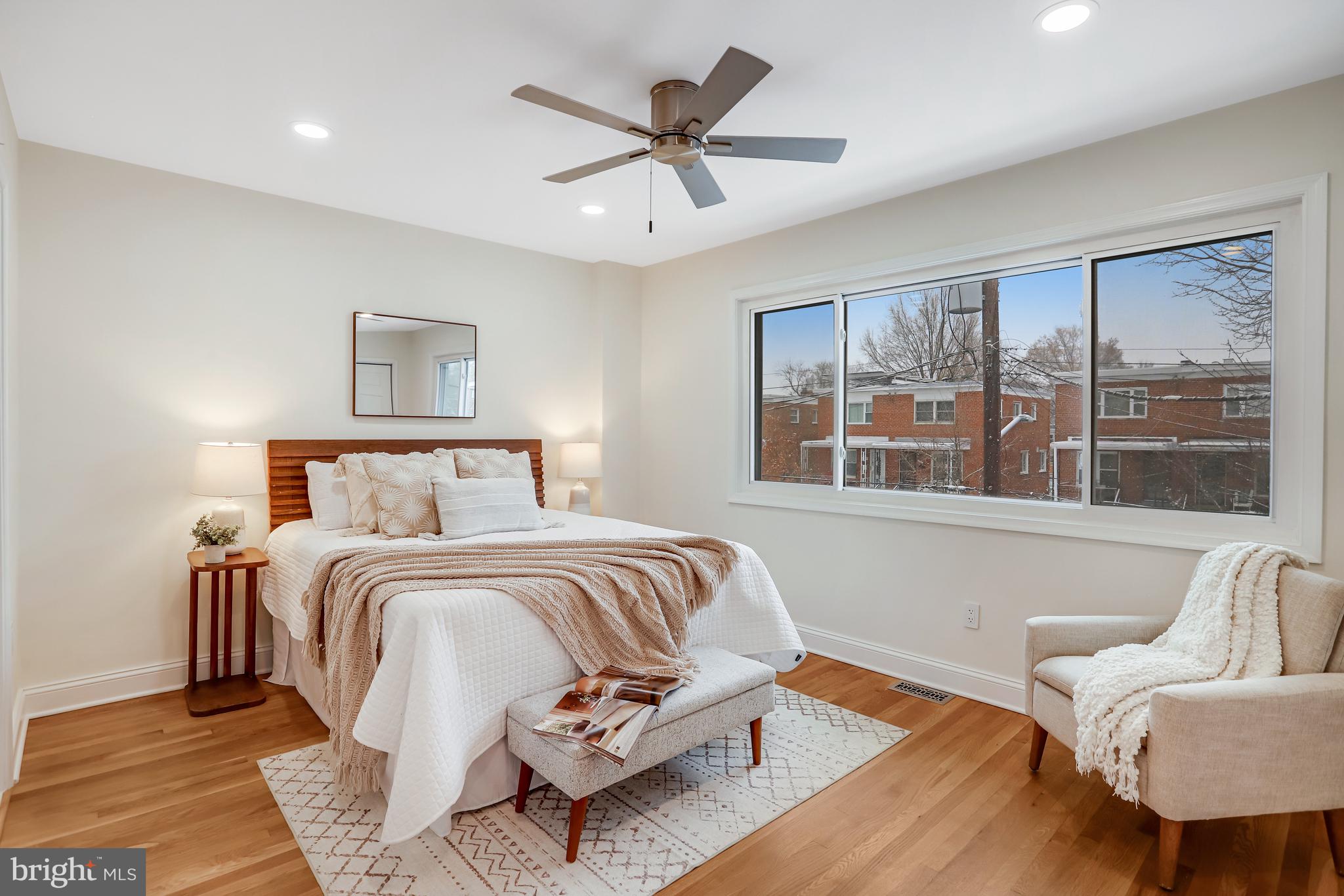 720 Decatur Street Northeast Washington, DC 20017 - Photo 12 of 26 a bed room with a bed and a couch