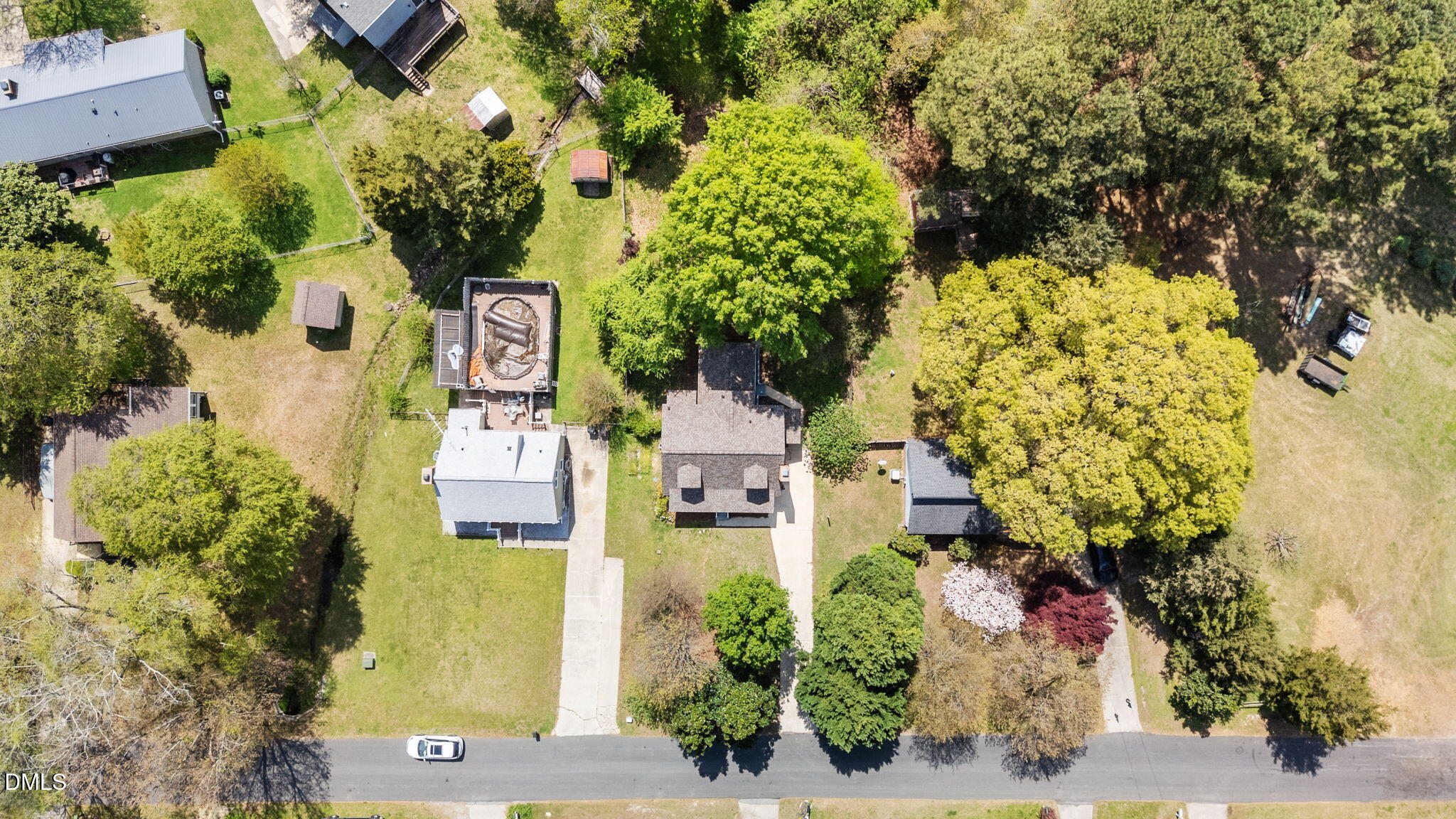 804 Olive Street Apex, NC 27502 - Photo 45 of 60 an aerial view of a house with a yard swimming pool and garden