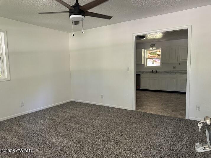 5 Clearview Avenue Trezevant, TN 38258 - Photo 3 of 17 an empty room with a ceiling fan and a window