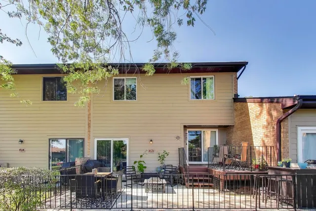 a front view of house with yard outdoor seating and barbeque oven