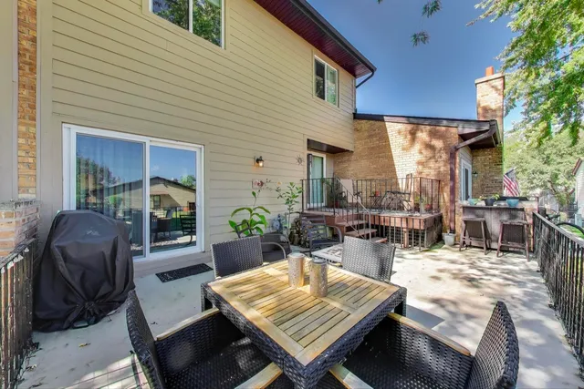 a view of a dinning tables and chairs in patio of the house