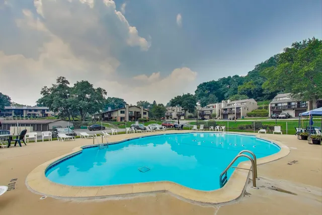 a view of a swimming pool with a patio