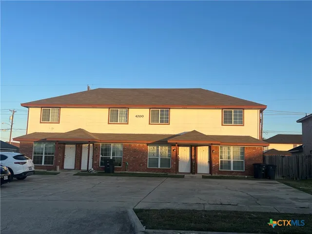 a front view of a house with yard