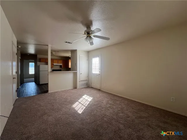 a view of a kitchen with a sink a kitchen island with wooden floor and a kitchen view