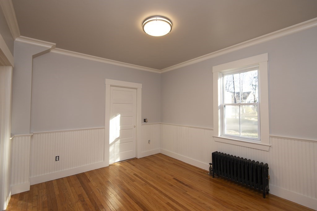 2 Burnside Street Maynard, MA 01754 - Photo 12 of 21 a bedroom with a bed and a window