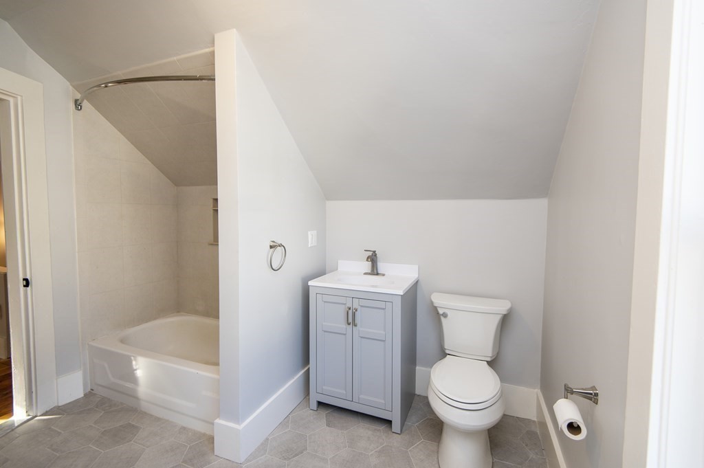 2 Burnside Street Maynard, MA 01754 - Photo 17 of 21 a bathroom with a toilet a sink and bathtub