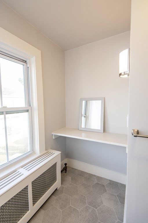 2 Burnside Street Maynard, MA 01754 - Photo 18 of 21 a bathroom with a bathtub and a window