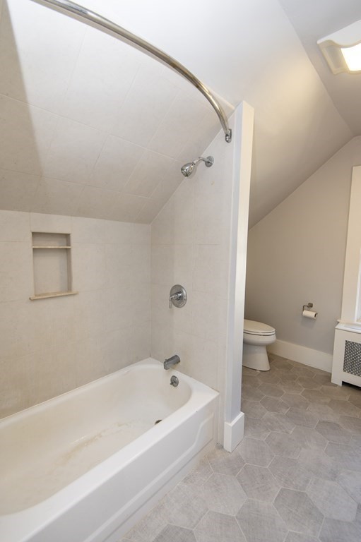 2 Burnside Street Maynard, MA 01754 - Photo 19 of 21 a bathroom with a bathtub and a toilet