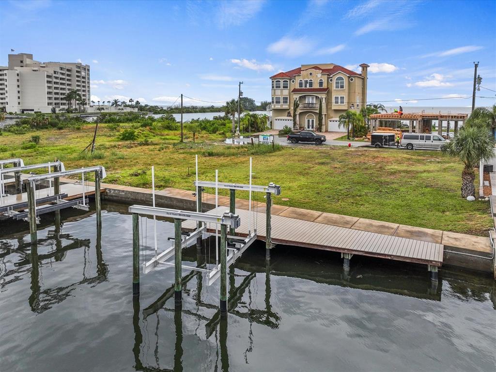 6200 Lonnie Lee Lane Hudson, FL 34667 - Photo 2 of 13 a view of a swimming pool with outdoor seating and yard