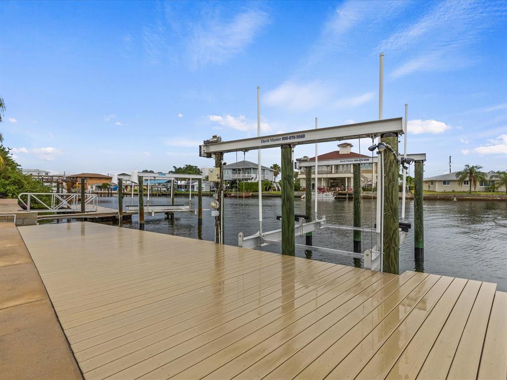 6200 Lonnie Lee Lane Hudson, FL 34667 - Photo 7 of 13 a view of swimming pool with outdoor seating and yard in back