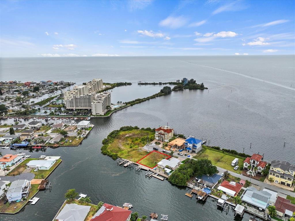 6200 Lonnie Lee Lane Hudson, FL 34667 - Photo 9 of 13 an aerial view of a houses with a lake view